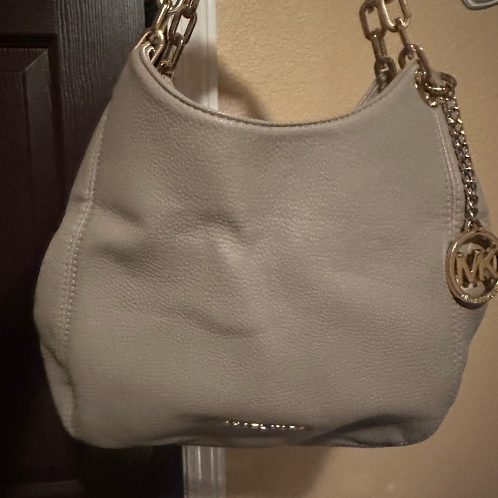 Michal kors, can be worn shoulder or crossbody.